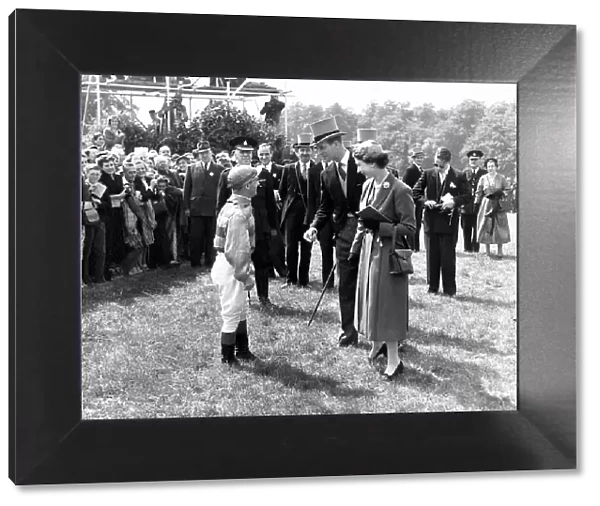 Jockey Gordon Richards is congratulated by Queen Elizabeth II after winning the Epsom