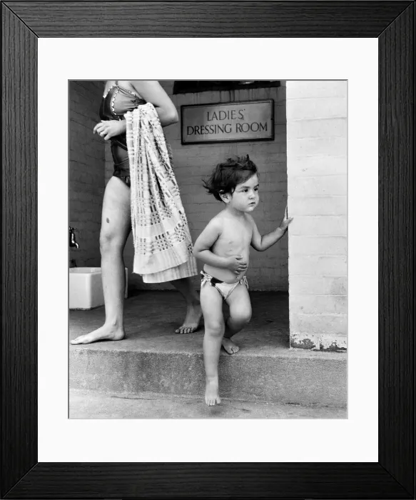 Framed Print : Two year old Judith Fisher comes out of the ladies dressing room to go for a swim
