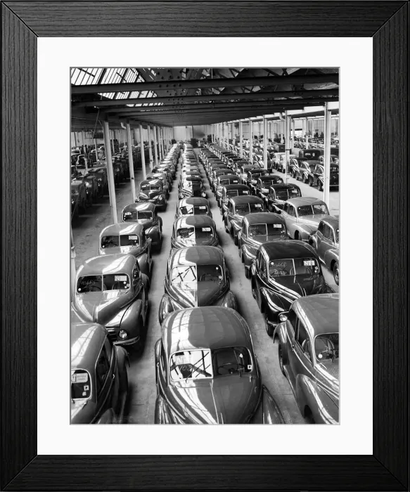 Framed Print : Morris Minor Low Light Sedans fresh of the production line being packed for export Framed Print : Morris Minor Low Light Sedans fresh of the production line being packed for export