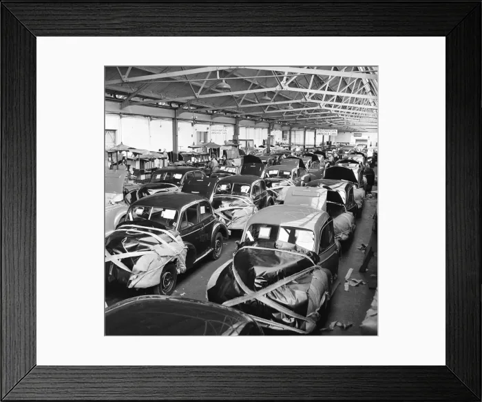Framed Print : Morris Minor Low Light Sedans fresh of the production line Framed Print : Morris Minor Low Light Sedans fresh of the production line