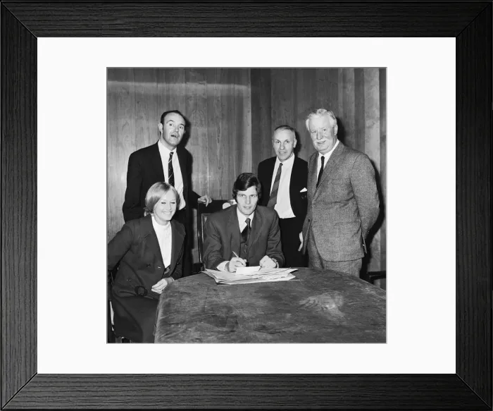 Framed Print : Liverpools new signing John Toshack from Cardiff City signs his contract accompanied Framed Print : Liverpools new signing John Toshack from Cardiff City signs his contract accompanied