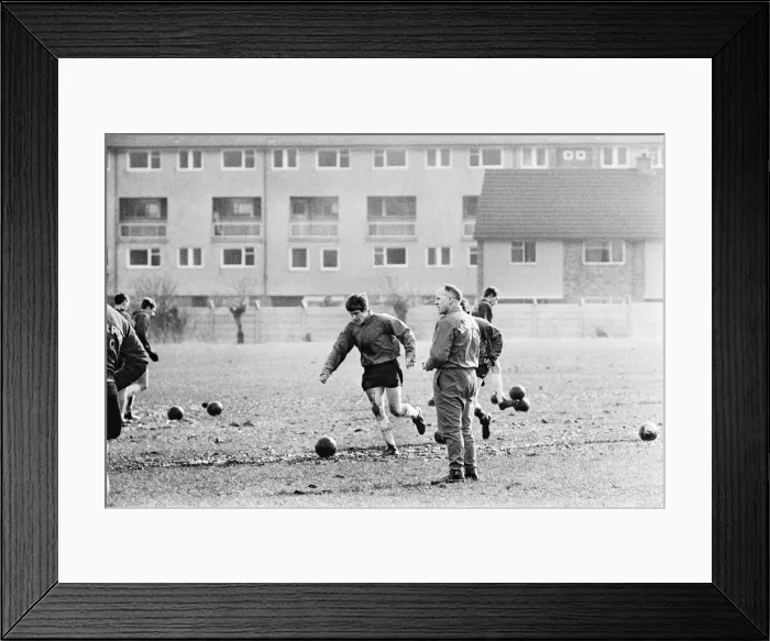 Framed Print : Liverpool manager Bill Shankly watches new signing Emlyn Hughes during a training session Framed Print : Liverpool manager Bill Shankly watches new signing Emlyn Hughes during a training session