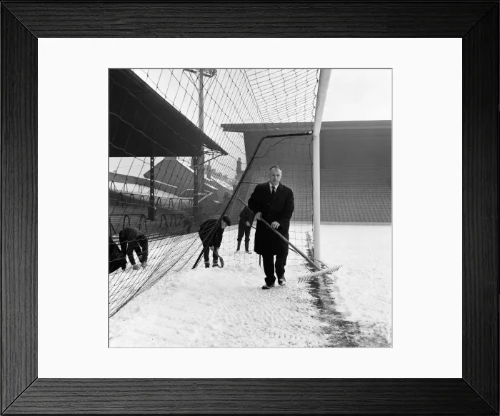 Framed Print : Liverpool manager Bill Shankly helps to clear the snow from the goal line on the Anfield Framed Print : Liverpool manager Bill Shankly helps to clear the snow from the goal line on the Anfield