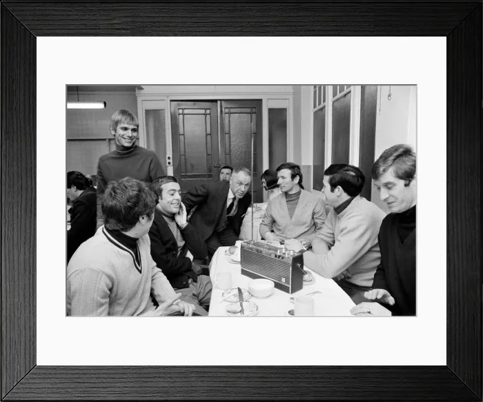 Framed Print : Liverpool manager Bill Shankly listening to the FA Cup draw with some of his players over Framed Print : Liverpool manager Bill Shankly listening to the FA Cup draw with some of his players over