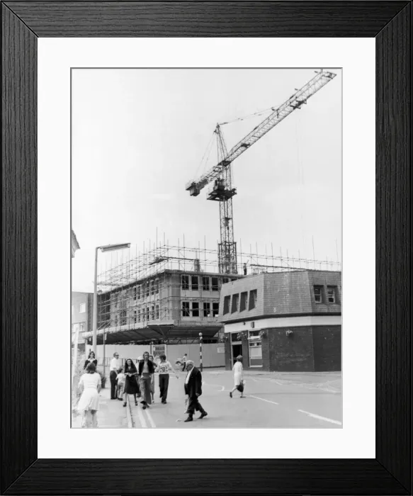 Framed Print : A giant crane towers above the Post Office in King Street as the latest part of Framed Print : A giant crane towers above the Post Office in King Street as the latest part of