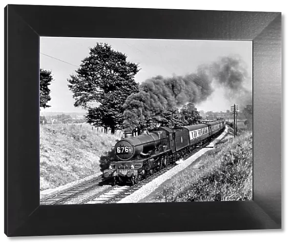 A steam locomotive engine making its way through the Warwickshire countryside, circa 1950