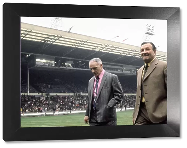 Liverpool manager Bill Shankly walks on to the pitch accompanied by Bob Paisley at