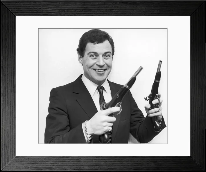 Framed Print : Birmingham Comedian, David Ismay seen posing with a gun in either hand Framed Print : Birmingham Comedian, David Ismay seen posing with a gun in either hand