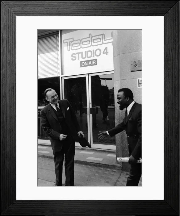 Framed Print : Enoch Powell MP Wolverhampton South West, pictured being greeted by a man as he leaves Framed Print : Enoch Powell MP Wolverhampton South West, pictured being greeted by a man as he leaves