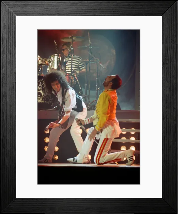 Framed Print : Queen rock group performing. Singer Freddie Mercury with guitarist Brian May