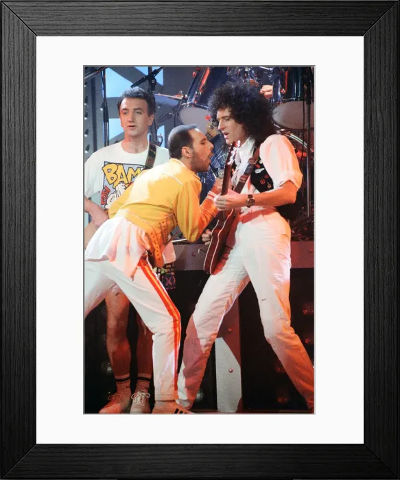 Framed Print : Queen rock group performing. Singer Freddie Mercury with guitarist Brian May
