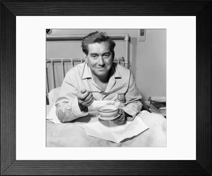 Framed Print : Tony Hancock pictured here from his hospital bed, 2nd August 1957 Framed Print : Tony Hancock pictured here from his hospital bed, 2nd August 1957