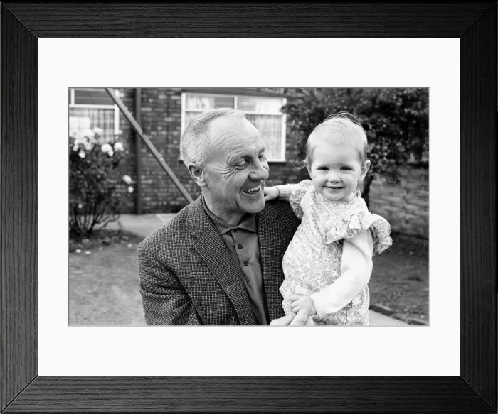 Framed Print : Former Liverpool manager Bill Shankly pictured relaxing at home with family following his Framed Print : Former Liverpool manager Bill Shankly pictured relaxing at home with family following his