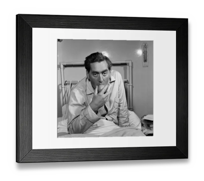 Framed Print : Tony Hancock pictured here from his hospital bed, 2nd August 1957 Framed Print : Tony Hancock pictured here from his hospital bed, 2nd August 1957