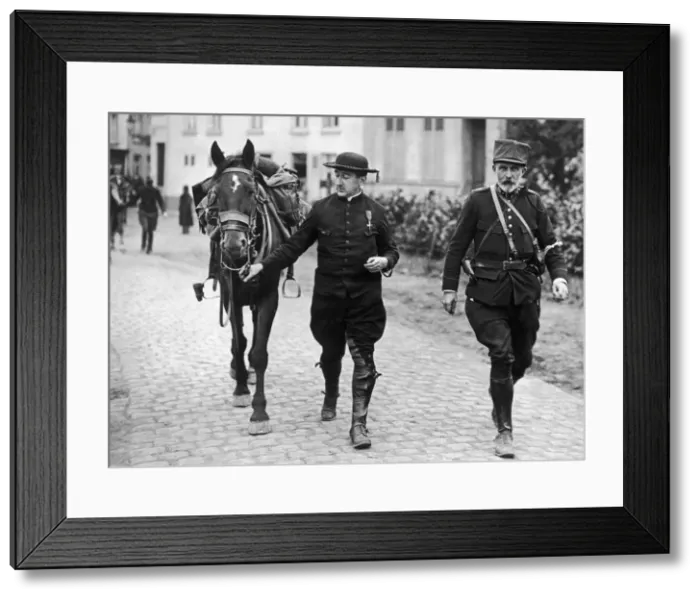 Framed Print : Belgian priest decorated for his bravery is seen here with a cavalry officer following Framed Print : Belgian priest decorated for his bravery is seen here with a cavalry officer following