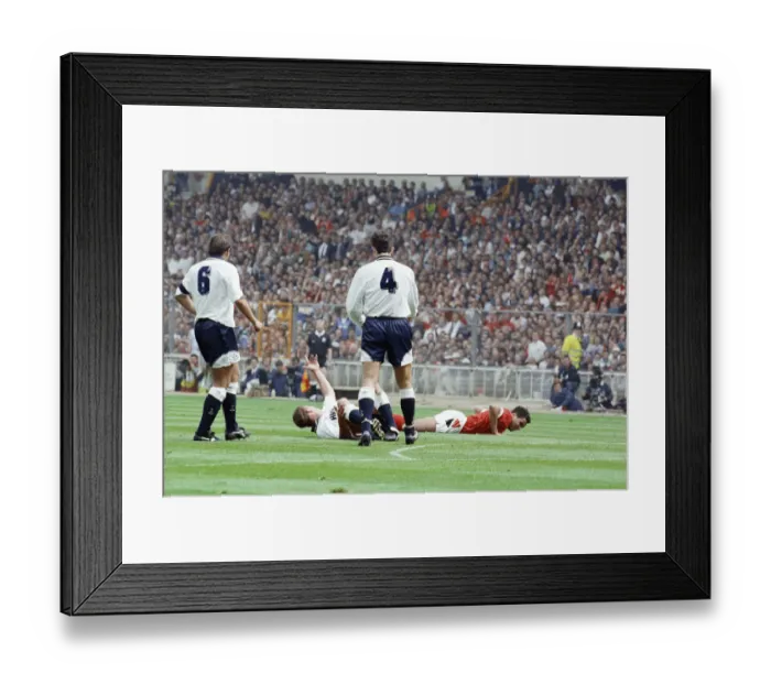 Framed Print : Paul Gascoigne of Tottenham Hotspur Football Club lies on the ground waving to