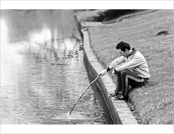 Brian Clough Nottingham Forest manager sitting on the river bank thinking