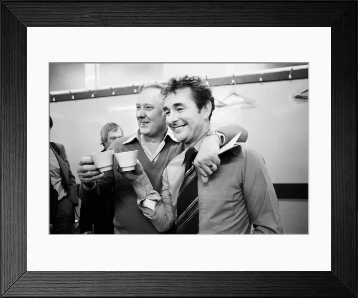 Framed Print : Manager Brian Clough celebrates in the dressing room with assistant Peter Taylor after Framed Print : Manager Brian Clough celebrates in the dressing room with assistant Peter Taylor after
