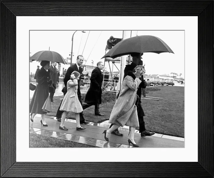 Framed Print : It was a wind-and-the-rain send off for Prince Philip when he left London Airport for his Framed Print : It was a wind-and-the-rain send off for Prince Philip when he left London Airport for his
