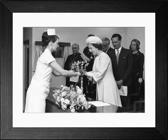 Framed Print : The Queen is presented with a bouquet of flowers during her visit to Walsgrave Hospital Framed Print : The Queen is presented with a bouquet of flowers during her visit to Walsgrave Hospital
