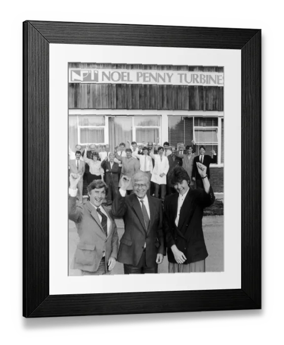 Framed Print : Noel Penny, owner and Chairman of Noel Penny Turbines celebrates as he signs a joint