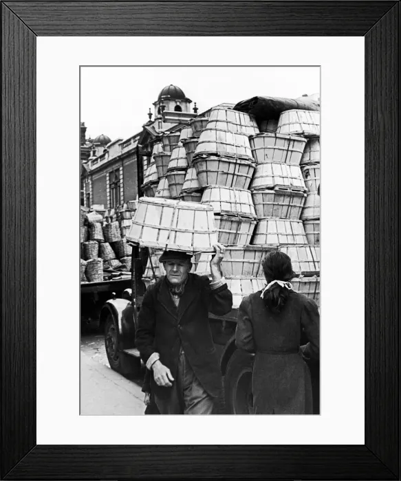 Framed Print : Covent Garden Market, Elderly man carried baskets on his head through the market streets Framed Print : Covent Garden Market, Elderly man carried baskets on his head through the market streets
