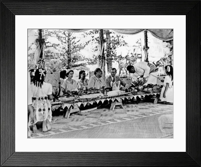 Framed Print : Queen Elizabeth II and Prince Philip with the Queen of Tonga at a feast at which a Framed Print : Queen Elizabeth II and Prince Philip with the Queen of Tonga at a feast at which a