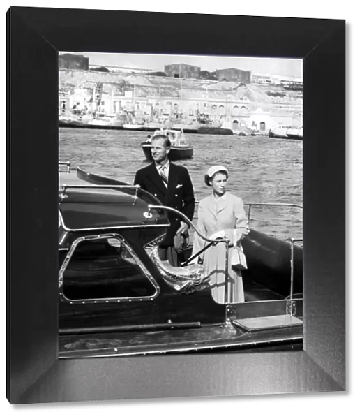 Queen Elizabeth II and Prince Philip leave Malta harbour to go aboard the Royal Yatch