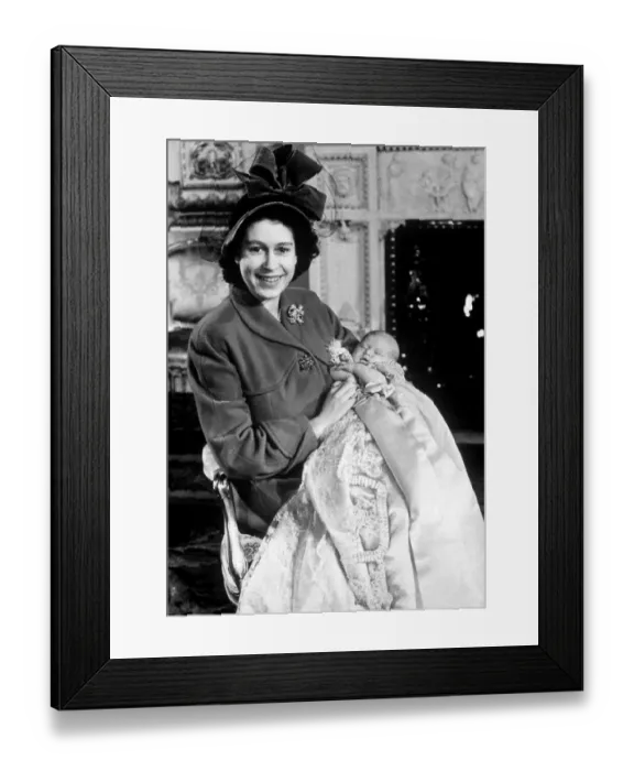 Framed Print : Princess Elizabeth holds her baby son Prince Charles in the drawing room at Buckingham