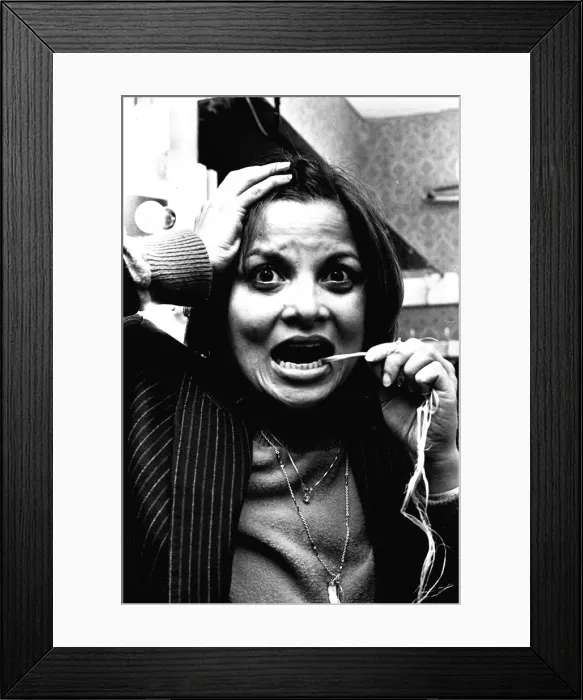 Framed Print : Sexy actress Francoise Pascal is driving down to London to see her dentist to get rid of