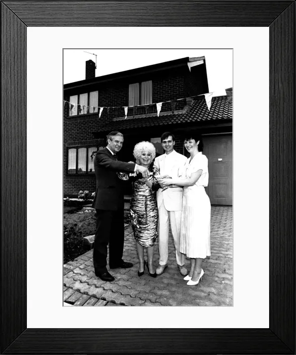 Framed Print : Actress Barbara Windsor proposes a house-warming toast to DIY builders Allan Framed Print : Actress Barbara Windsor proposes a house-warming toast to DIY builders Allan