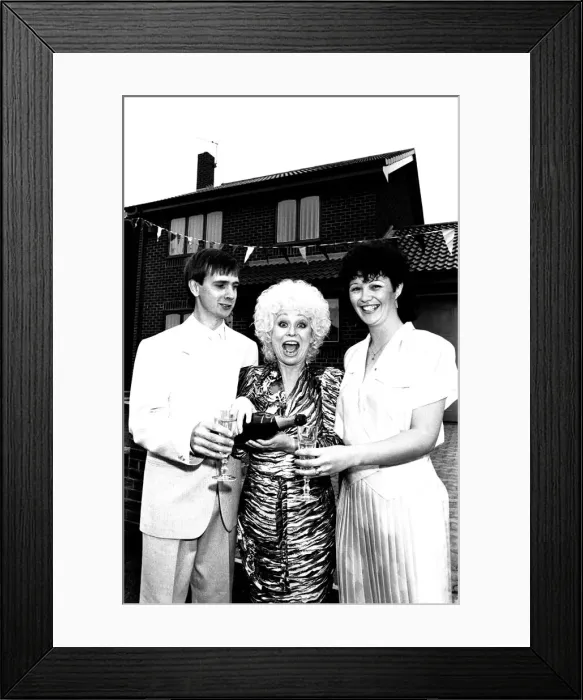 Framed Print : Actress Barbara Windsor proposes a house-warming toast to DIY builders Allan Framed Print : Actress Barbara Windsor proposes a house-warming toast to DIY builders Allan