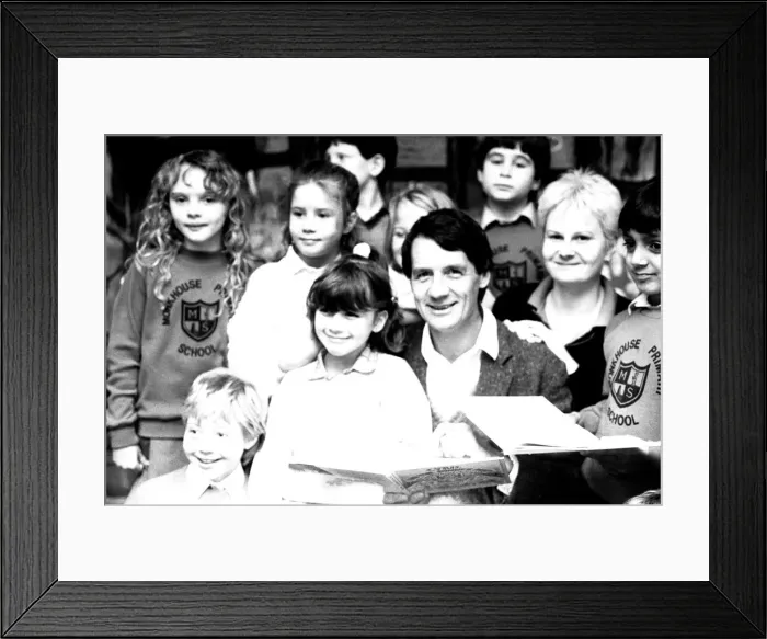 Framed Print : Actor Michael Palin pays a surprise visit to Monkhouse Primary School in North Shields to Framed Print : Actor Michael Palin pays a surprise visit to Monkhouse Primary School in North Shields to