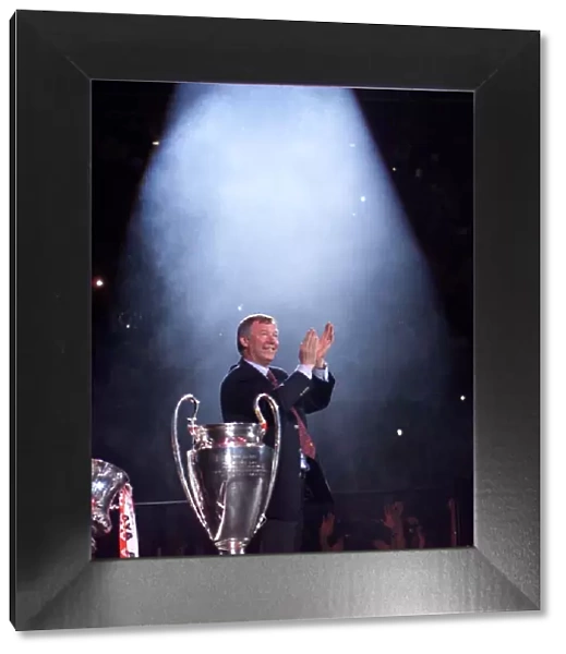 Alex Ferguson in the spotlight receiving May 1999 the cheers of the Manchester