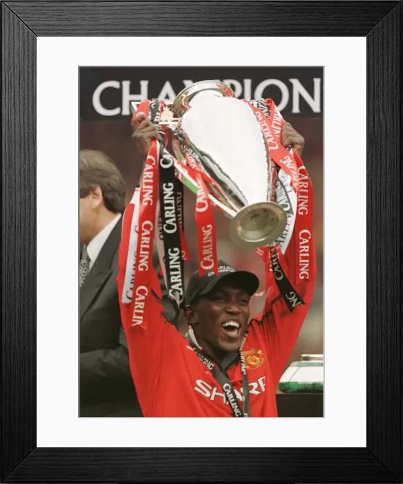 Framed Print : Dwight Yorke celebrates May 1999 after Manchester United winning 2-1 against Framed Print : Dwight Yorke celebrates May 1999 after Manchester United winning 2-1 against