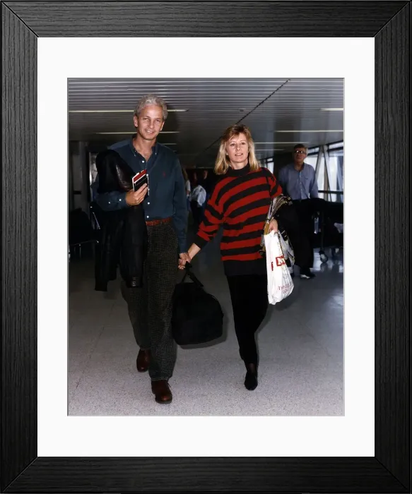 Framed Print : David Gower Cricketer with his girlfriend Thorunn Nash pictured at Heathrow airport Framed Print : David Gower Cricketer with his girlfriend Thorunn Nash pictured at Heathrow airport