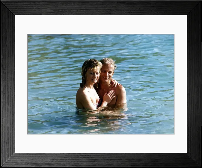 Framed Print : David Gower cricketer with Thorrun Nash in the sea during their visit to the West Indies Framed Print : David Gower cricketer with Thorrun Nash in the sea during their visit to the West Indies