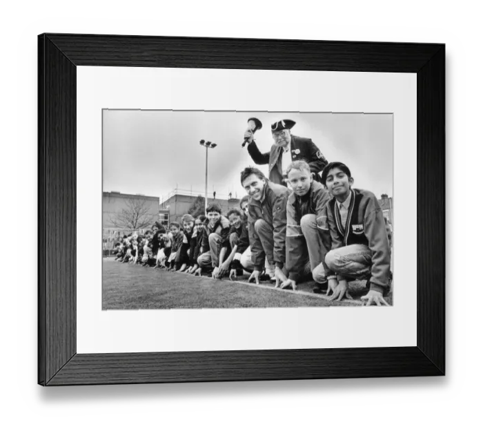 Framed Print : Athlete Dave Moorcroft with pupils on the new all-weather pitch at Sidney Stringer school Framed Print : Athlete Dave Moorcroft with pupils on the new all-weather pitch at Sidney Stringer school