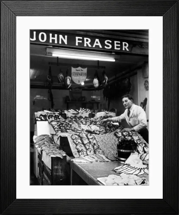 Framed Print : John Fraser the Fishmonger lays out his wares for the days shoppers