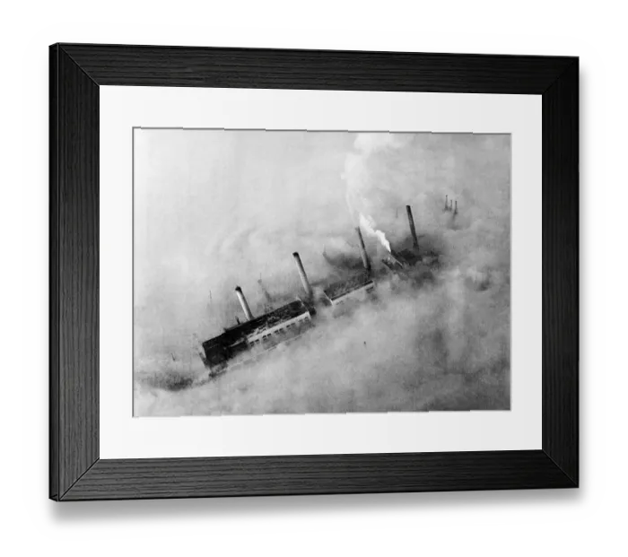 Framed Print : Chimneys of an East End factory poke through the blanket of smog covering London Framed Print : Chimneys of an East End factory poke through the blanket of smog covering London