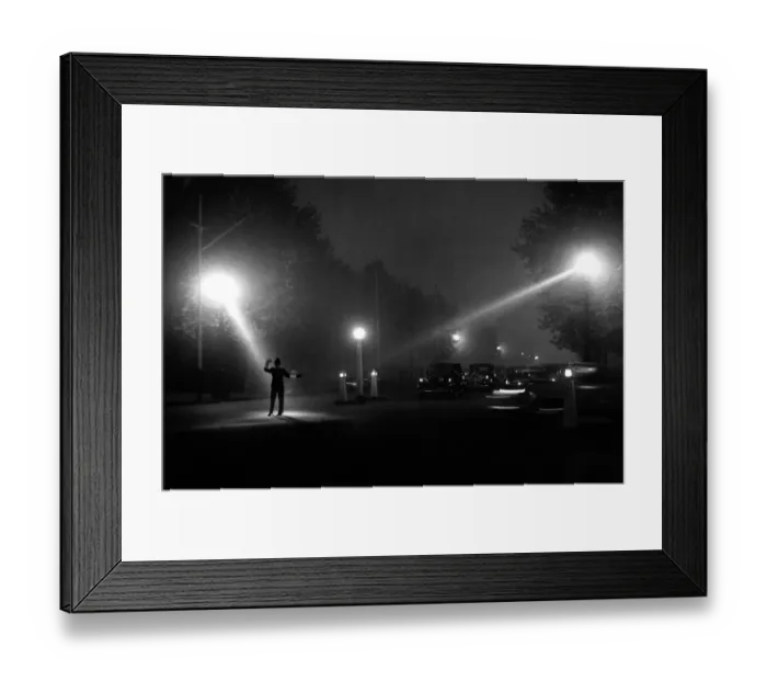 Framed Print : Policeman directing traffic in the fog and dark of a late autumn evening October 1958