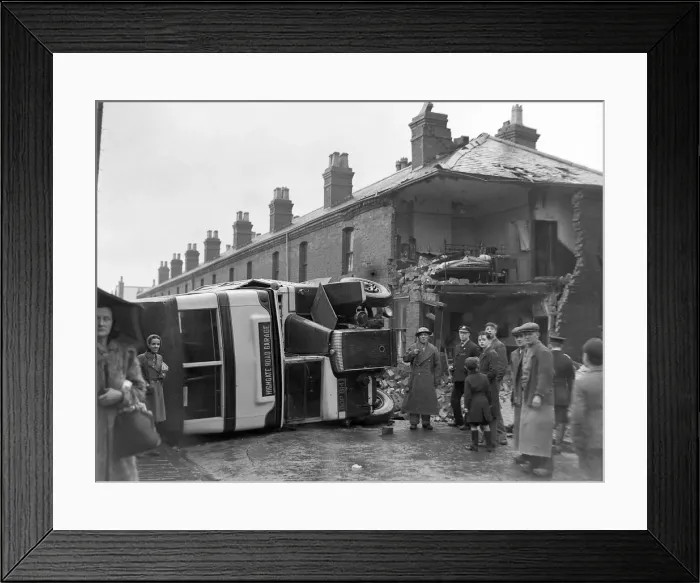 Framed Print : People gather round an overturned bus Bus in Sparbrook, Birmingham following an air raid Framed Print : People gather round an overturned bus Bus in Sparbrook, Birmingham following an air raid