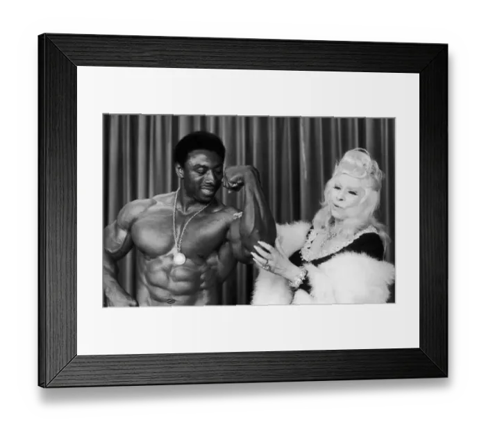 Framed Print : Mae West seen here with Mr America Dave Johns 30th August 1977 Framed Print : Mae West seen here with Mr America Dave Johns 30th August 1977