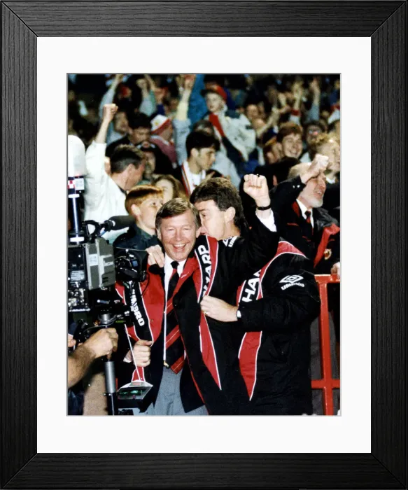 Framed Print : Manchester United manager Alex Ferguson celebrates with assistant Brian Kidd as his team