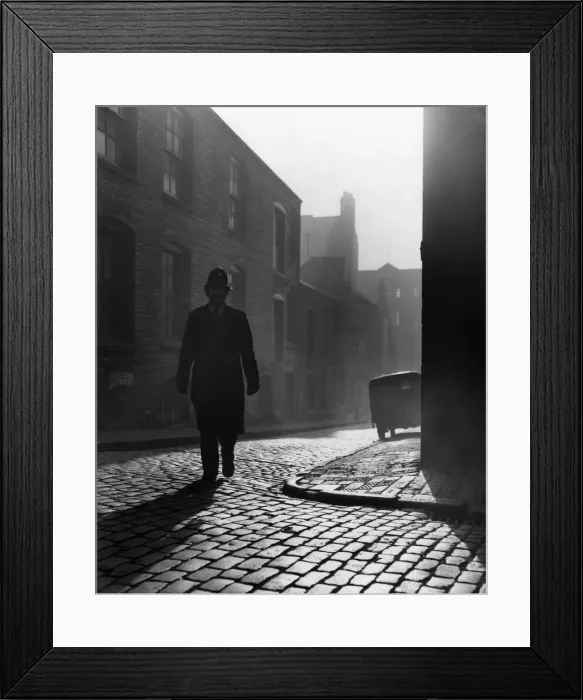 Framed Print : Birmingham Emergency Services. A police officer walking on the beat in the early