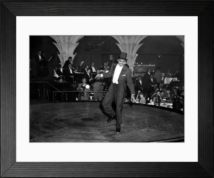 Framed Print : Ex - boxer Sugar Ray Robinson entertaining at a show business party in London Framed Print : Ex - boxer Sugar Ray Robinson entertaining at a show business party in London