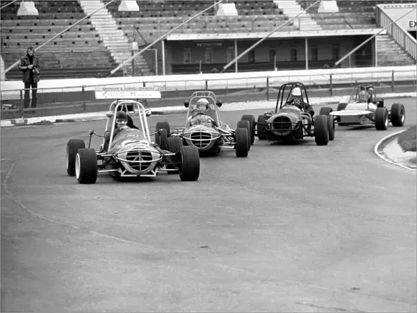 Mini Grand Prix: White City Stadium: Graham Hill. March 1975