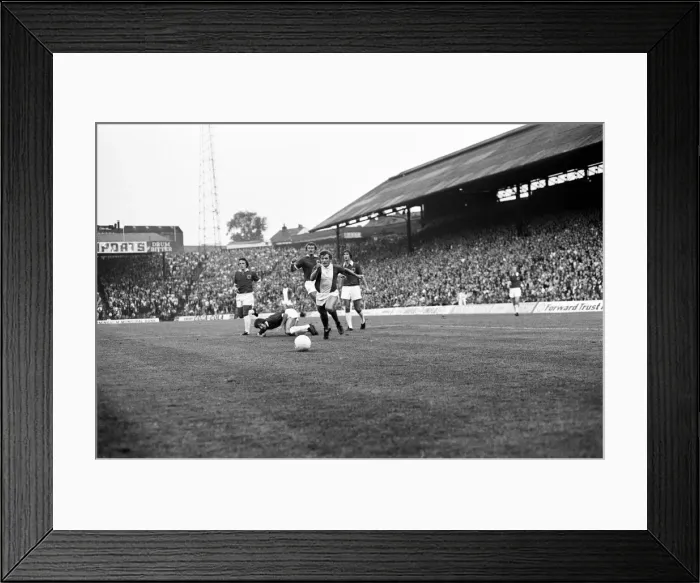 Framed Print : Blues midfielder Gordon Taylor shows a clean pair of heels to Leicester quartet of Earle Framed Print : Blues midfielder Gordon Taylor shows a clean pair of heels to Leicester quartet of Earle