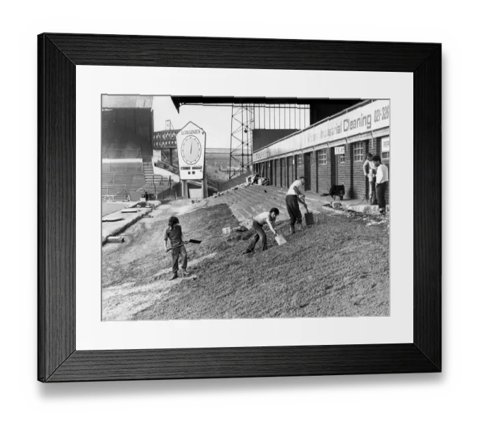 Framed Print : Workmen are busy preparing the ground before beginning work on the Railway End stand Framed Print : Workmen are busy preparing the ground before beginning work on the Railway End stand