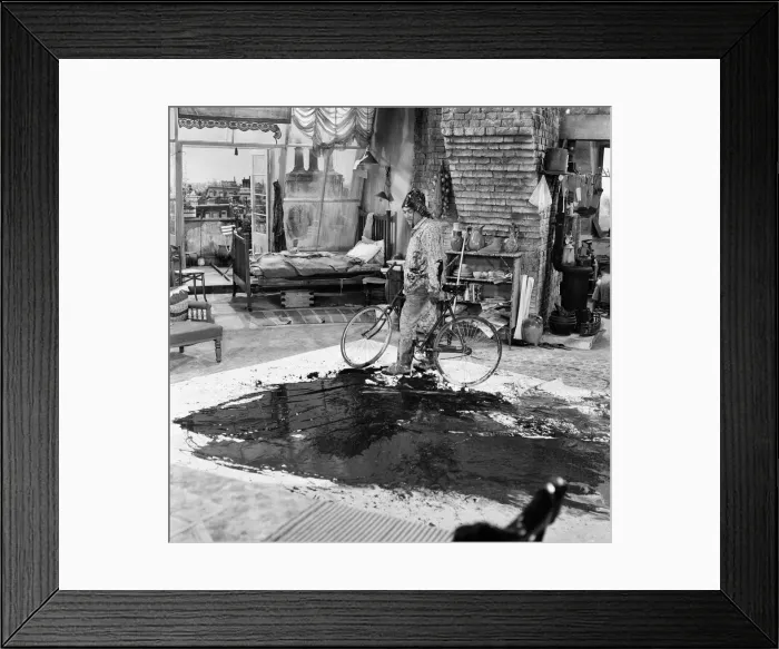 Framed Print : Tony Hancock rides a bike around the set as he films The Rebel at Elstree Framed Print : Tony Hancock rides a bike around the set as he films The Rebel at Elstree